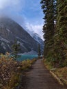 View of the shore of Lake Louise in Banff National Park, Canada in the Rocky Mountains in autumn season. Royalty Free Stock Photo