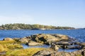 View of the shore of Porkkalanniemi, grass, stones and water, Kirkkonummi, Finland Royalty Free Stock Photo