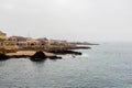 View of the shore with town buildings. Illes Balears, Spain.