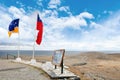 View of the shores from the lighthouse of the Magdalena Island and of sign near flags, from the lighthouse, during a