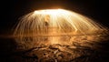 View of showers of glowing sparks from burning spinning steel wool