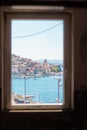 View of the Sibenik city from a nearby building framed in the window frame. Old city on the coast of the adriatic sea, cathedral Royalty Free Stock Photo