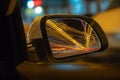 View from Side of Car moving in a night city, Blured road with lights with car on high speed. Concept rapid rhythm of a modern Royalty Free Stock Photo