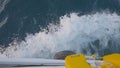 View from side deck of ship on waves. Action. Ship moves through waves of blue sea. Waves beat against moving ship of Royalty Free Stock Photo