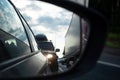 View in the side mirror of a car on the road. Traffic congestion, a large congestion of cars, difficult traffic Royalty Free Stock Photo