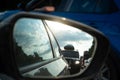 View in the side mirror of a car on the road. Traffic congestion, a large congestion of cars, difficult traffic Royalty Free Stock Photo