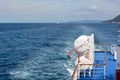 View from the side of a sea ship on the blue sea and the waves behind it Royalty Free Stock Photo