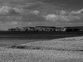 A view from Sidmouth to the west of Exmouth across the stone, shingle,beach to West Devon and the cliffs Royalty Free Stock Photo