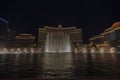 View of sights of Las Vegas at night on Strip overlooking fountains of Bellagio hotel. Royalty Free Stock Photo