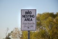 View of sign Bird Nesting Area, Dogs Must be on Leash in Courtenay