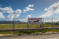 View of sign Danger near the Princess Juliana International Airport next to Maho Beach