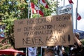 View of sign The Holocaust Began by Demonization and Marginalization during the rally against the BC Vaccine Card in front of