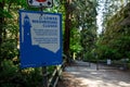 View of sign Lower Washrooms Closed inside Lighthouse Park in West Vancouver