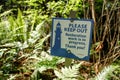 View of sign Please Keep Out Restoration work is in Progress inside Lighthouse Park in West Vancouver