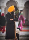 View of a Sikh devotee as holy guard in the golden temple shri Harmandir Sahib in Amritsar, India Royalty Free Stock Photo