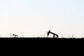 Silhouette oil rig derricks field Royalty Free Stock Photo