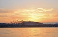 View of silhouettes of cranes and a hill against the sky Royalty Free Stock Photo