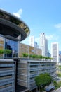 View of the Singapore Supreme Court Building with its unique flying saucer shaped roof, set against the Financial District