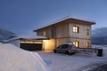 View of single-family house with garage in snow-covered winter with cleared entrance Royalty Free Stock Photo