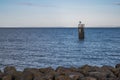 A view of a single guide post, in the Bristol channel, just outside of Cardiff Bay. Royalty Free Stock Photo