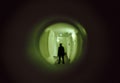 View of a sinister man through the peephole, spy-hole door - concept stalker or criminal mind in general Royalty Free Stock Photo