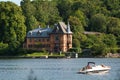 View of Sirishov Villa on Djurgarden island in Stockholm with Rosendal Castle and trees on the coast