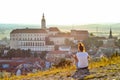 Tourist girl overlooking Mikulov Castle, Moravia, Czech Republic