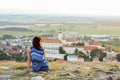 Tourist girl overlooking Mikulov Castle, Moravia, Czech Republic