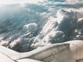 View of sky from above the clouds and airplane engine Royalty Free Stock Photo