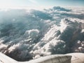 View of sky from above the clouds and airplane engine Royalty Free Stock Photo