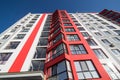 View at sky between apartment buildings. City landscape. Blue sky with clouds. Sunny day. Royalty Free Stock Photo