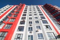 View at sky between apartment buildings. City landscape. Blue sky with clouds. Sunny day. Royalty Free Stock Photo