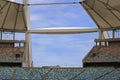 VIEW OF SKY THROUGH BEAMS OF ARCH ACROSS MOSES MABHIDA STADIUM DISPLAYING ROWS OF SEATS IN THE STADIUM Royalty Free Stock Photo