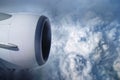 View of the sky and clouds from the airplane porthole. jet engine turbine look through aircraft window Royalty Free Stock Photo