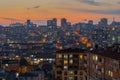 View of the warm sky after sunset over typical turkish residential buildings