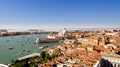 A view of the skyline overlooking the old town and canals of Venice, Italy on a sunny clear day.