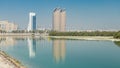 View of skyscrapers skyline with Al Bahr towers in Abu Dhabi timelapse. United Arab Emirates