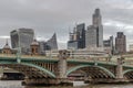 View of Skyscrapers and Southwark bridge in the business district over River thames in city of london Royalty Free Stock Photo