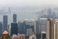 View on Skyscrapers with Victoria Bay, Transportation Ships, Harbour and Kowloon taken from Hongkong Island Peak. Hong Kong, China