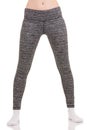 View of slim woman legs move apart to shoulders in grey patterned thermal pants in white socks