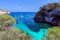 View of the small beautiful bay Cala Macarelleta with clear emerald water of the island Menorca, Balearic islands, Spain Royalty Free Stock Photo