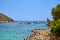 View of a small beautiful sandy beach with clear turquoise water