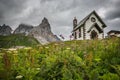 View of small church in the famous Passo Rolle with Pale di San Martino in the background, Italian dolomites, Trentino