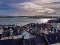 View of the small coastal Irish town of Cobh, urban landscape. Evening cloudy sky over the city. European urban architecture. Royalty Free Stock Photo