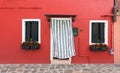Small, cozy courtyard with colorful cottage / Burano, Venice/ The small yard with bright walls of houses