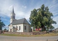 Old church with white tower in village of Rodowo, northern Poland Royalty Free Stock Photo