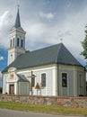 Old church with white tower in village of Rodowo, northern Poland Royalty Free Stock Photo