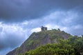 View of the small house seen on top of the mountain \