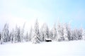 View of a small house in a winter landscape with deep snow Royalty Free Stock Photo