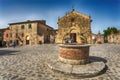 View of the small medieval village with stone walls of Monteriggioni in province of Siena, Tuscany, Italy.